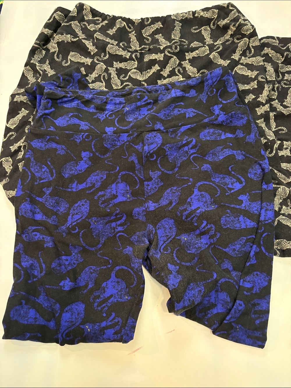 Two pairs of LuLaRoe Cat Silhouette Leggings- Black, Tan and Royal Blue